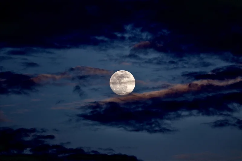 The full moon photographed against a black sky, its craters visible across the surface