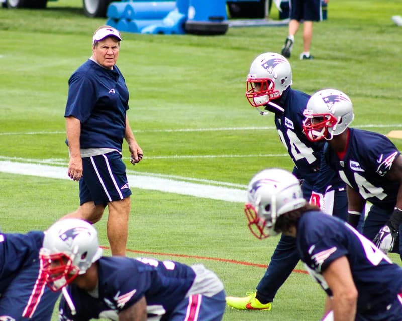 Head coach walking a college football sideline