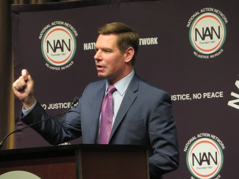 Eric Swalwell speaks into microphones on Capitol Hill