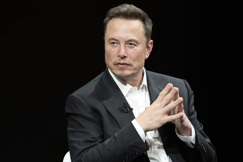 Elon Musk walking through a government building