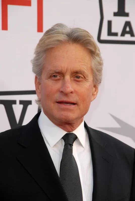 Michael Douglas at a film premiere, smiling