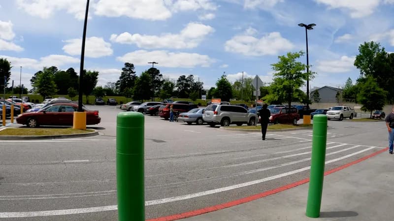 Storefront and parking lot of a suburban Walmart